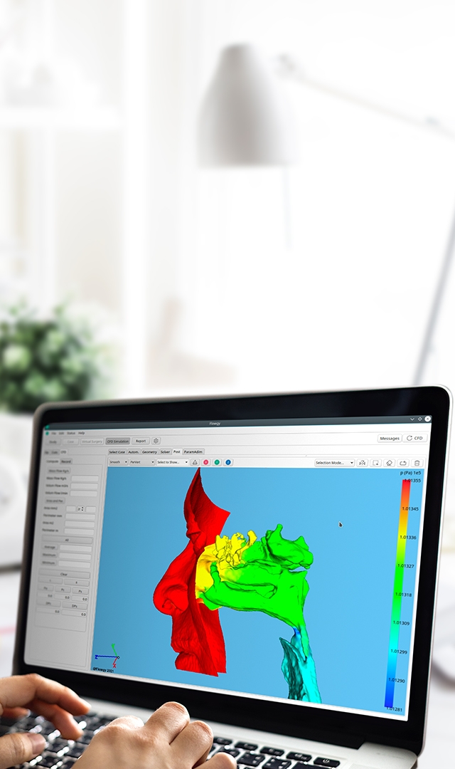 Image of a medical researcher working on a computer with the Flowgy Innovation software.